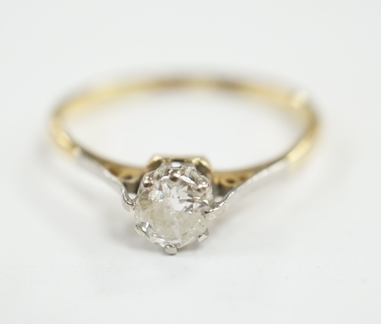 An 18ct and solitaire diamond ring, size O, gross weight 2.3 grams. Condition - fair